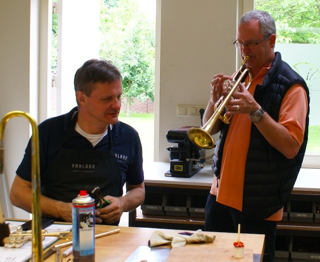 Horn maker Hub van Laar (seated) & Star Wars First Trumpet, Jon Lewis, with Van Laar's instrument. 