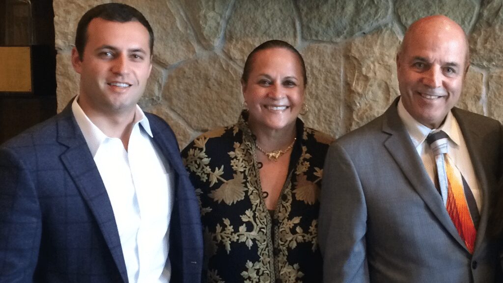 Justin Fareed with parents Linda and Don.