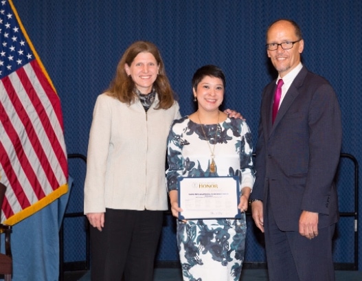 Charita with Deputy Undersecretary for International Affairs Carol Pier and Secretary of Labor Thomas E. Perez accepting an Exceptional Achievement award on behalf of the office for their work on making the Findings of the Worst Forms of Child Labor report a more useful policy tool.