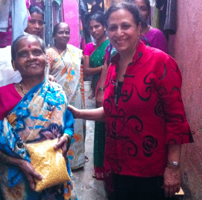 Geeta Mehta with resident in Dharavi involved with Social Capital Credits. There are 600,000 people living in Dharavi in roughly 90 distinct neighborhoods. These people supply the city with labor and inputs for industry, contributing 1 billion dollars into Mumbai’s economy. 