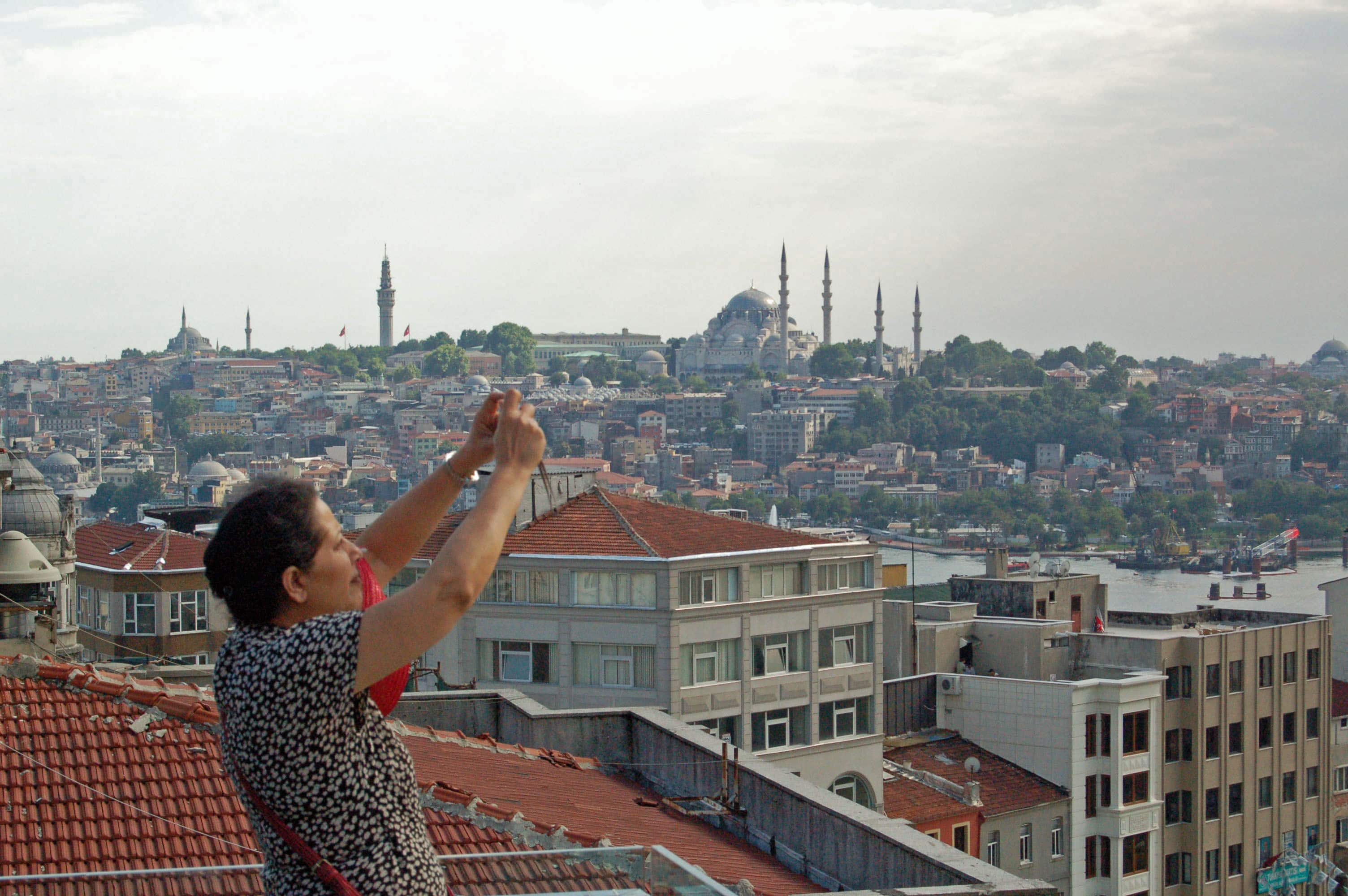 Geeta Mehta taking photos of Istanbul, Turkey while working with local groups demonstrating social capital of communities. 